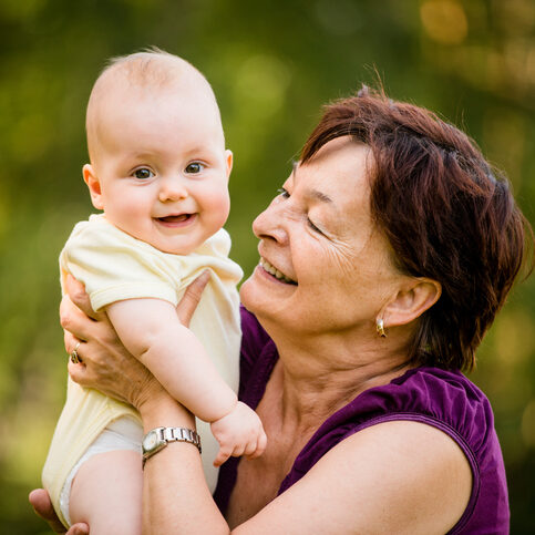 Happy retirement - grandmother with baby